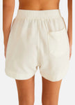 White shorts worn by a person on a white background