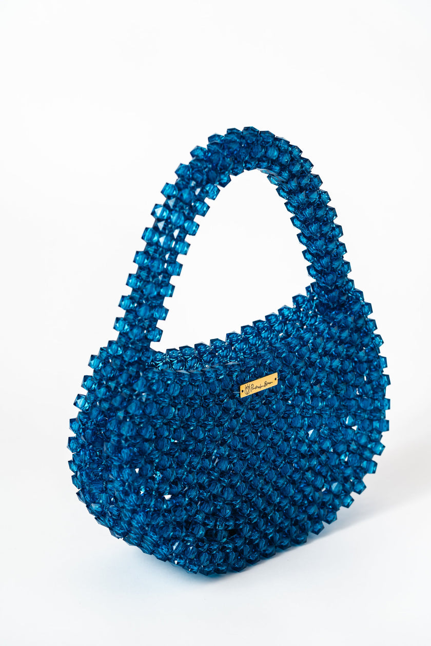 Bolso con cuentas hechas a mano y acrílico azul