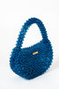 Bolso con cuentas hechas a mano y acrílico azul