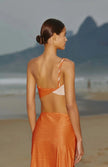 Rear view of the Luana Dress, revealing the open back with criss-crossed two-toned embellishment.