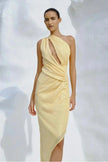 Front view of the Noe Dress, showcasing the one-shoulder style and flowing maxi-length skirt.