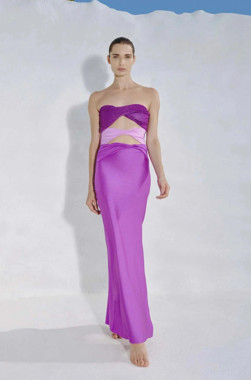 Model wearing the Efímero-colored Ola Maxi Dress, showcasing its strapless design with a heart-shaped neckline and front cutout details.
