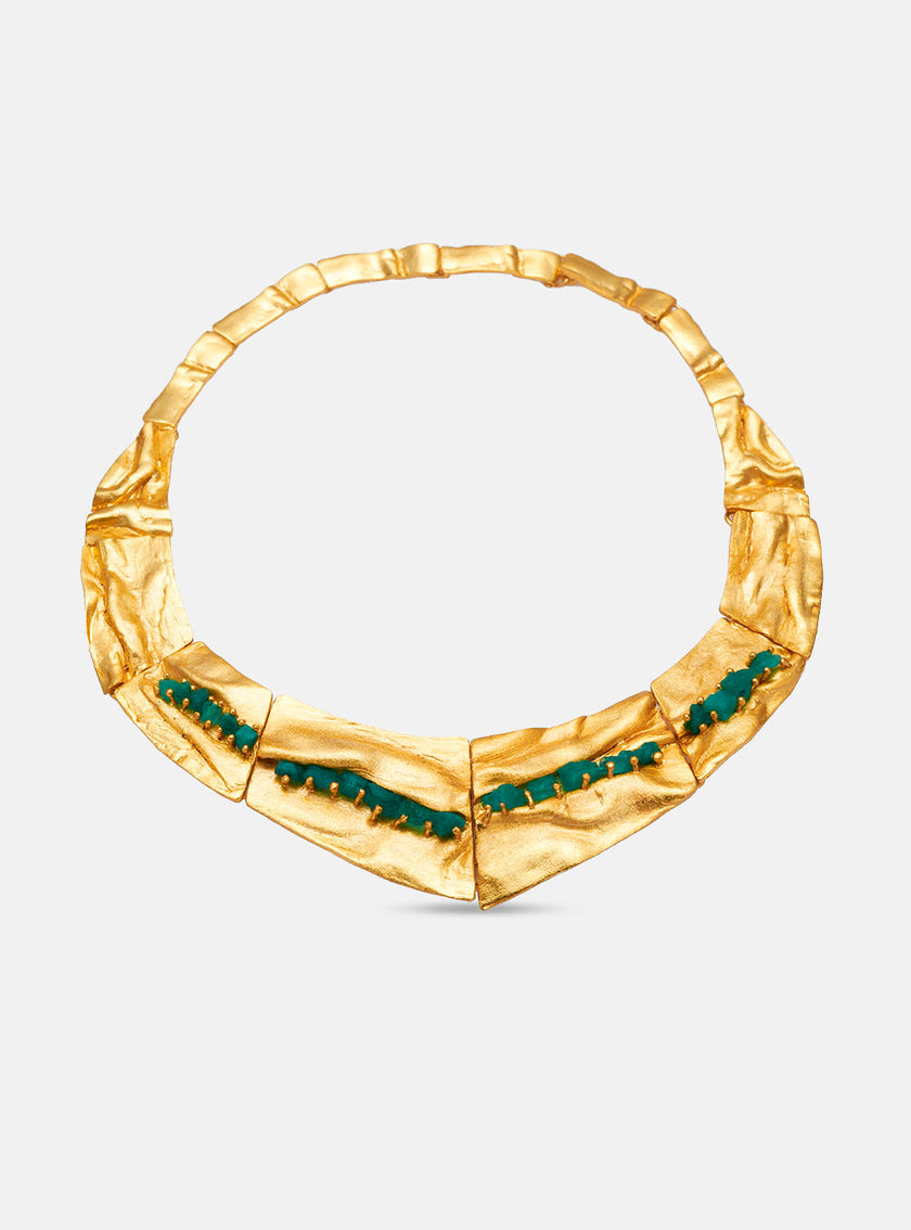 Front view of the Bimy necklace against a white background, handcrafted in bronze with 24k gold plating and Colombian emeralds.