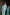 Model walking confidently down a hallway in Punta Cana wearing the Eloisa Long Set by ANTIBES, with a second model in a turquoise silk slip dress in the background, creating a contrast of textures and tones.