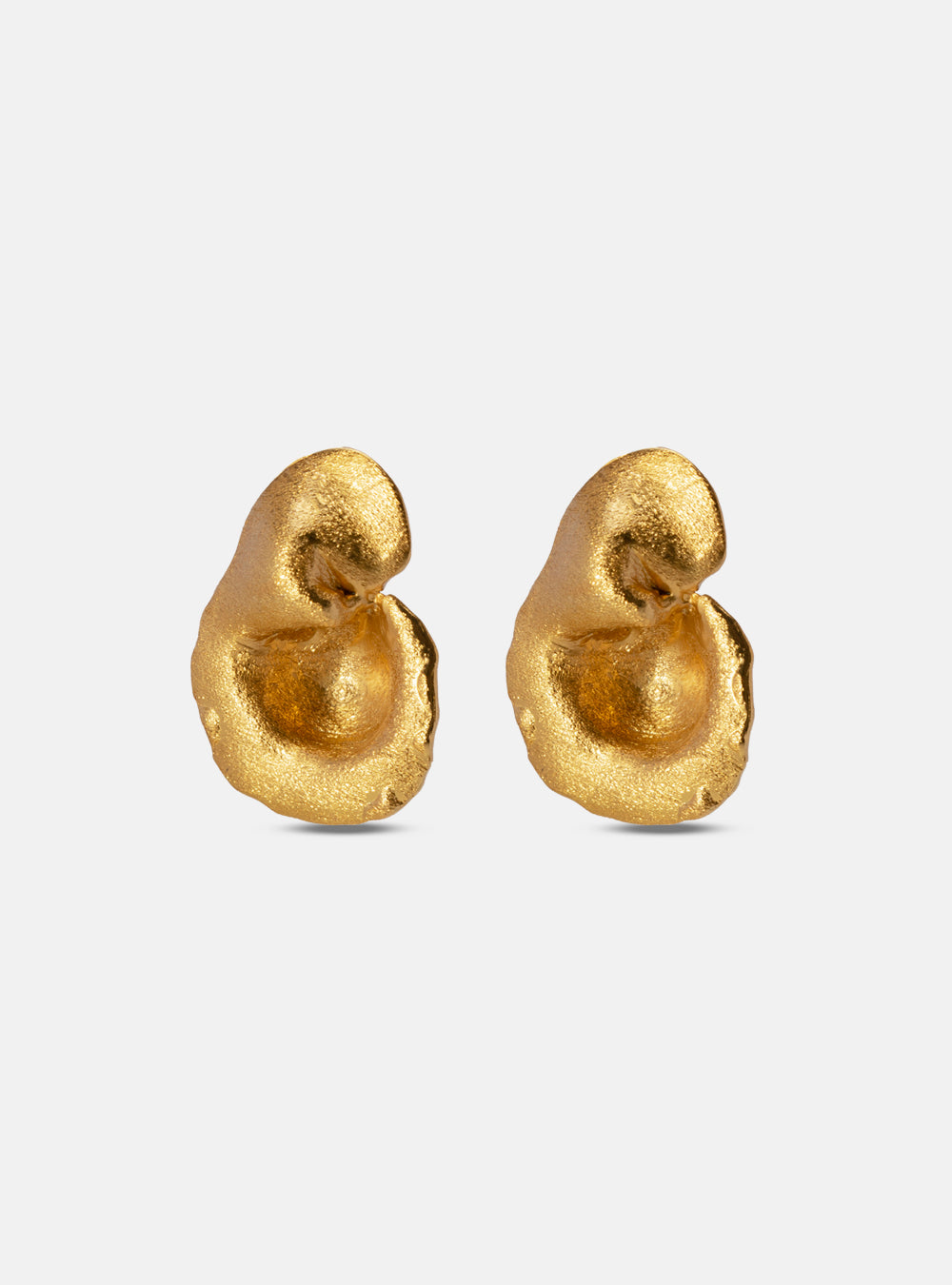 Pair of matte gold earrings with soft, curved surfaces and a fluid, asymmetrical design.