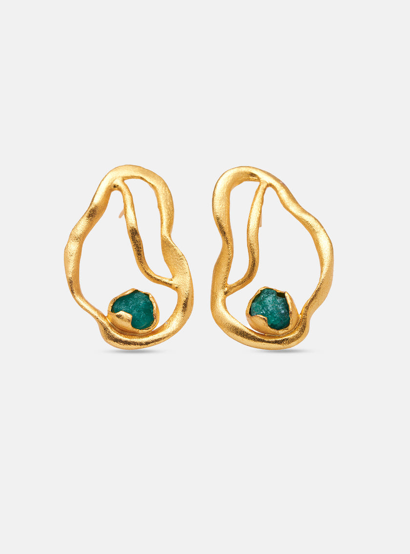 Front view of the Fuswa earrings on a white background, showcasing fluid gold forms with emerald accents.