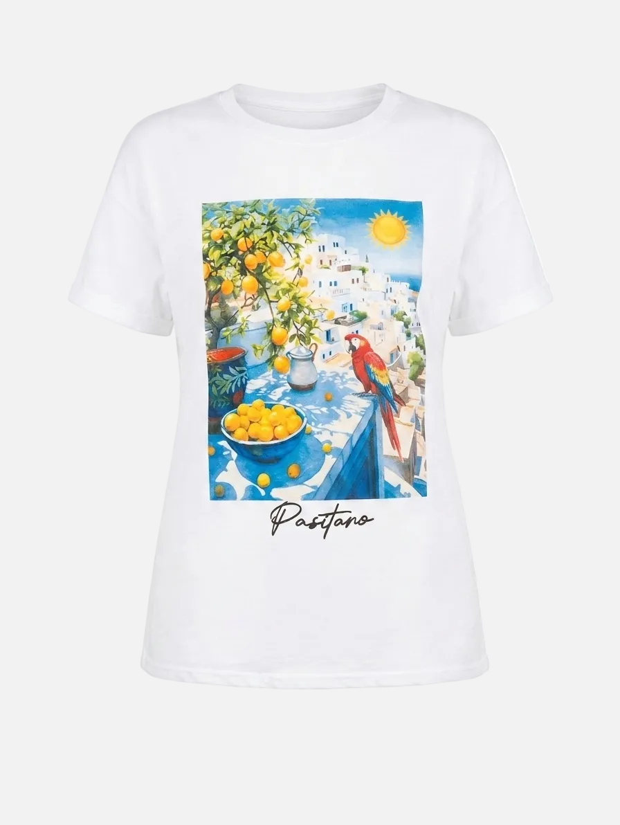 White t-shirt with a colorful print of a street scene in Positano, Italy.