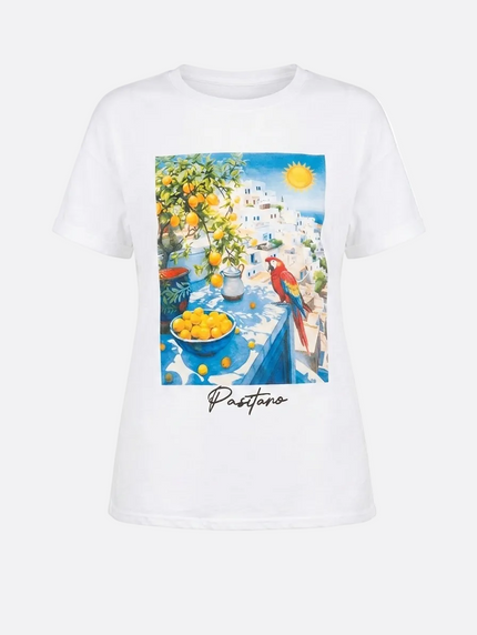 White t-shirt with a colorful print of a street scene in Positano, Italy.