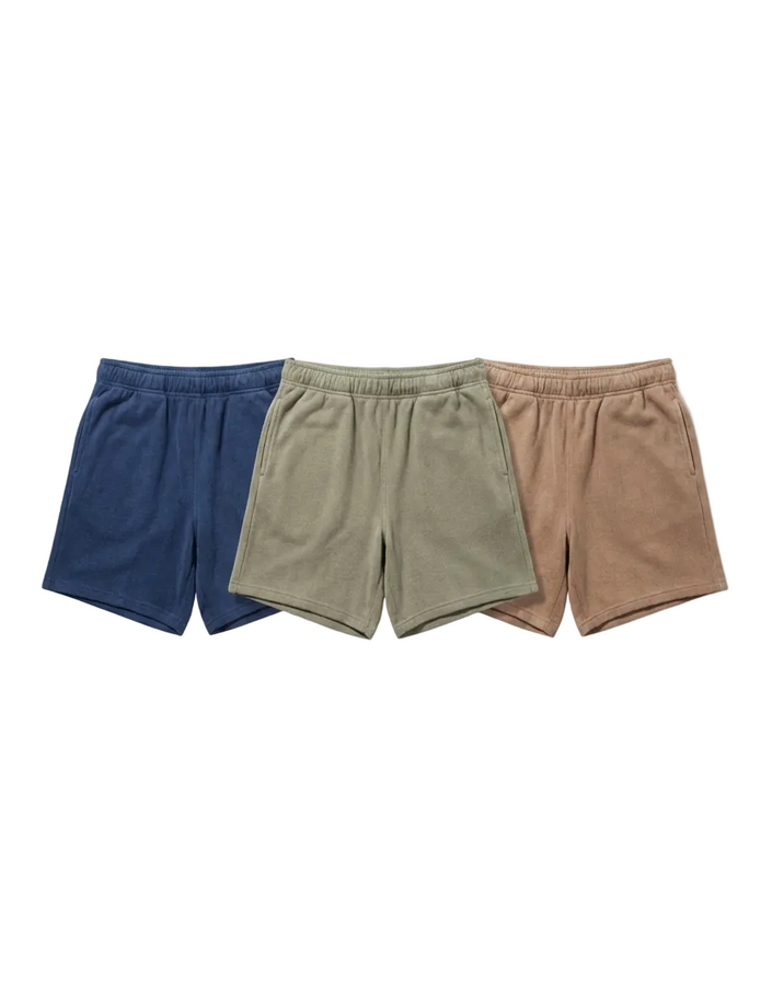 Three pairs of shorts in blue, green, and brown on a white background