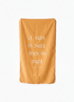 Orange towel with white text on a white background