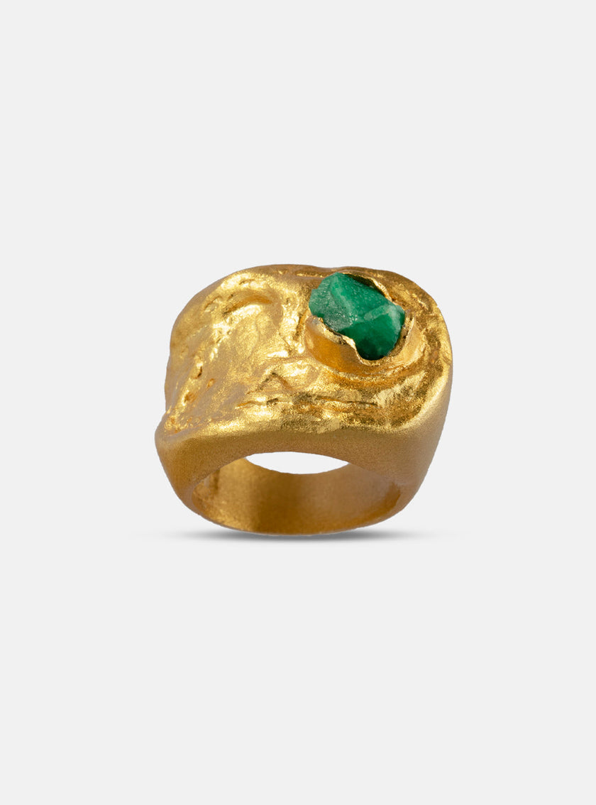 Front view of the Hyba ring highlighting its irregular shape and handcrafted emerald setting.
