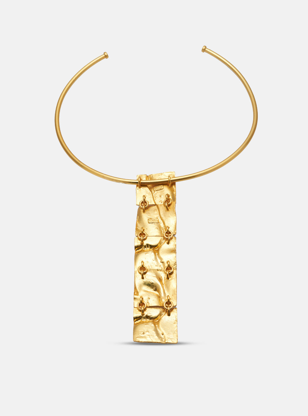 Back view of the Moky necklace pendant, revealing the handcrafted structure and connecting elements in gold-plated bronze.