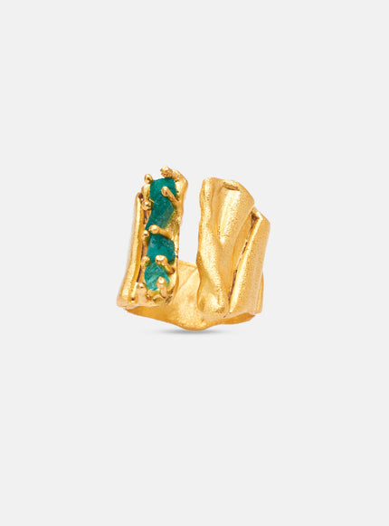 Gold-plated bronze ring with asymmetrical open band and raw emerald stones.