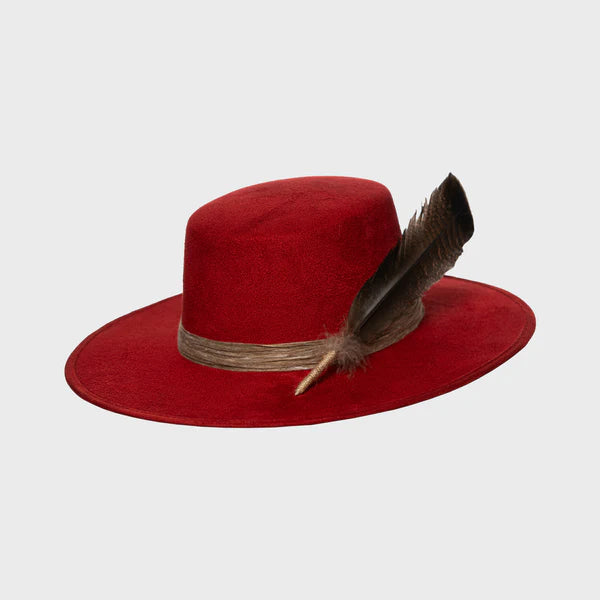 Angled side view of deep red suede hat featuring a natural feather accent and textured band, blending elegance and nature.