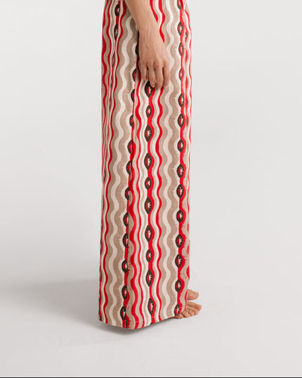 Red and white patterned dress on a white background