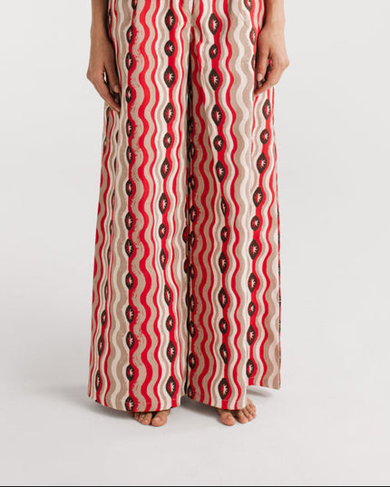 Red and white patterned dress on a white background