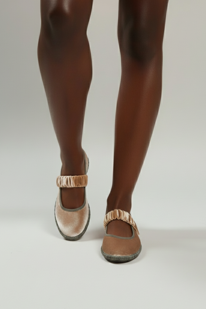 Brown shoes worn with tights on a white background