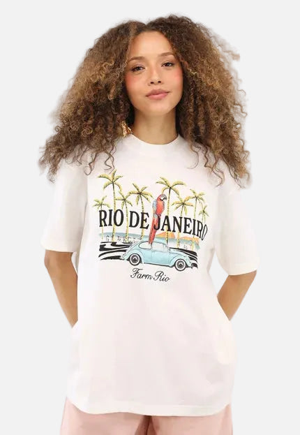 Person wearing a white t-shirt with 'Rio de Janeiro' design on a plain background